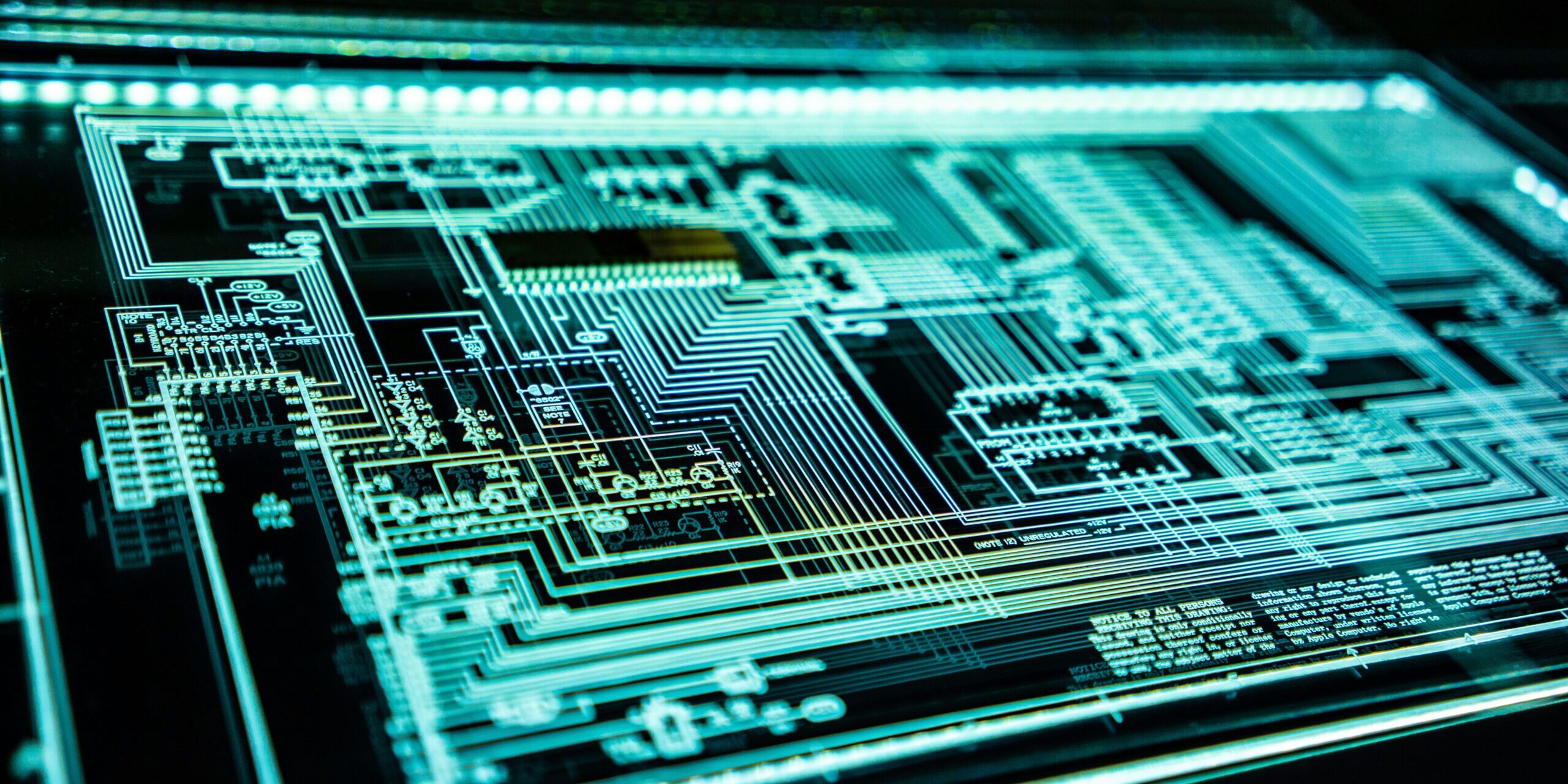 adi-goldstein-EUsVwEOsblE-unsplash Abstract circuit/computing graphic on light up screen